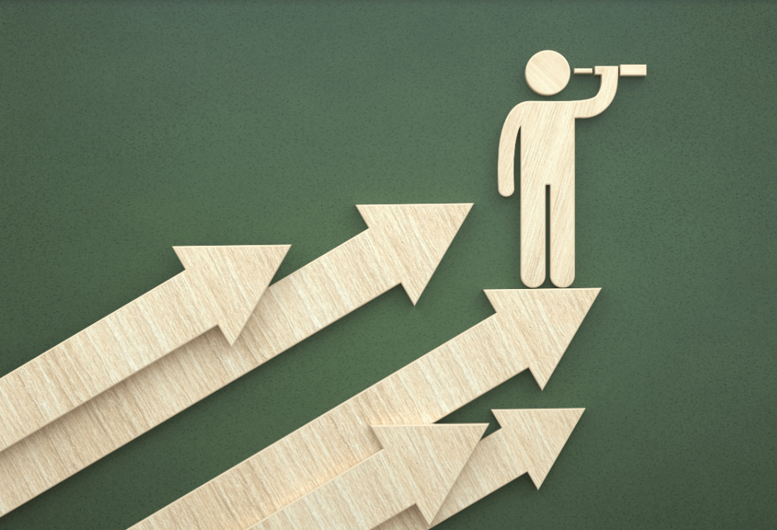 Wooden figure of a person using a telescope, standing on an upward-pointing arrow among several rising arrows, representing leadership development and capability building as a means of driving strategic direction and competitive advantage.